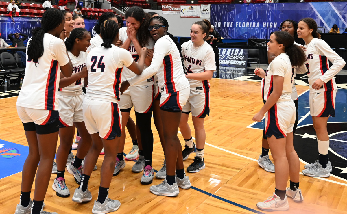 Miami Country Day players celebrate the team’s Class 3A state championship at the RP Funding Center in Lakeland on Friday. 